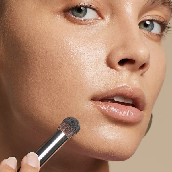 Model Using Domed Concealer Brush